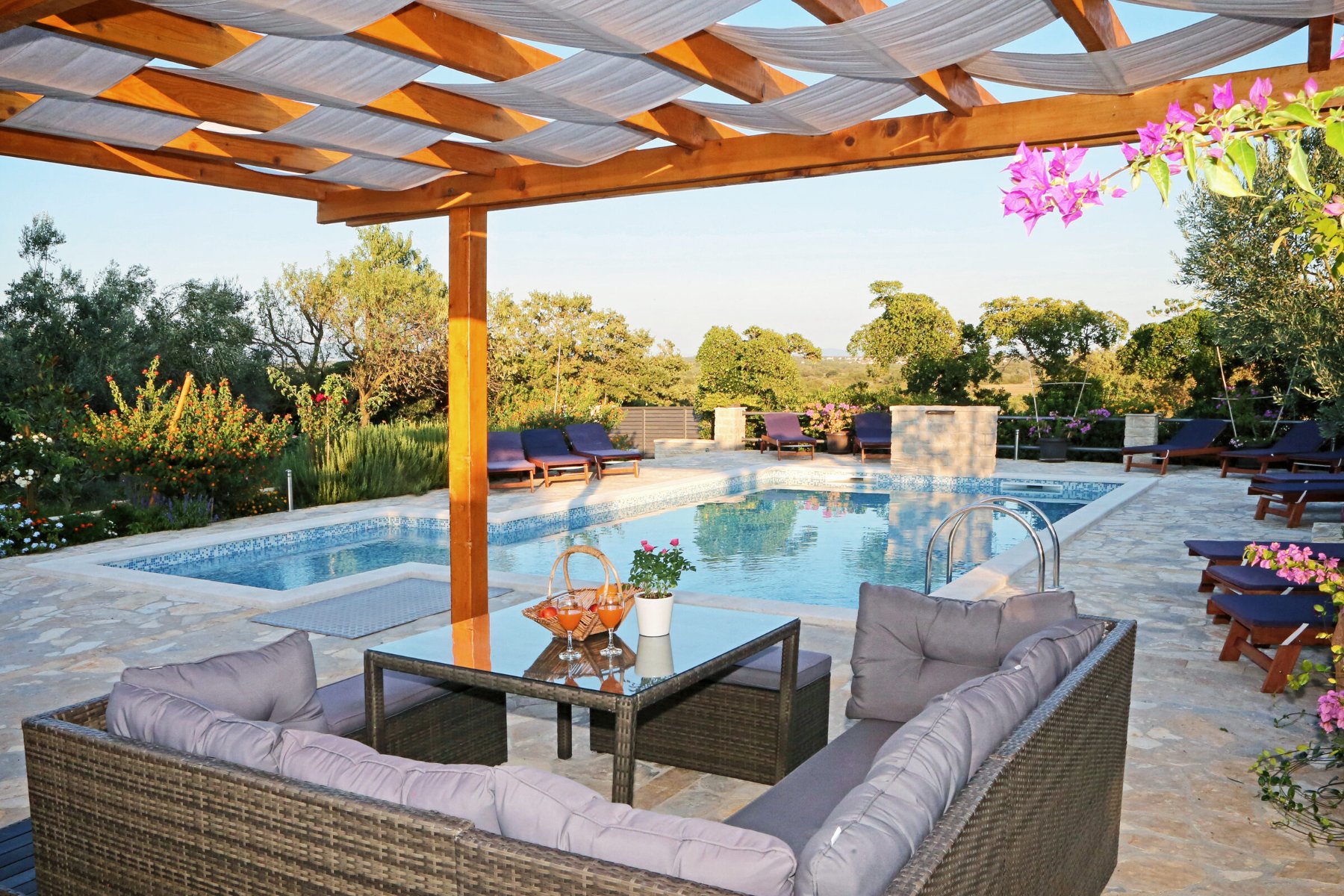 Shaded lounge seating by the pool