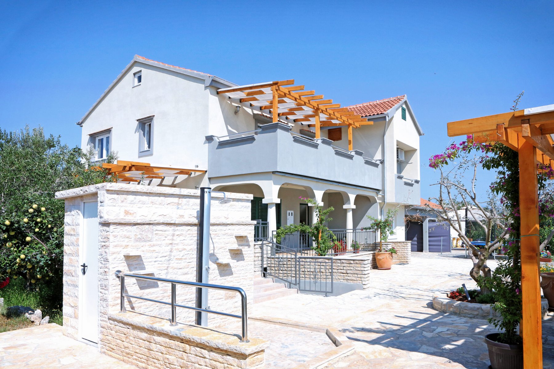 The entrance, with the solar-heated outdoor shower
